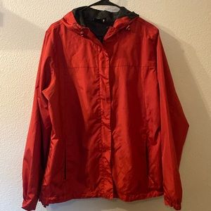OS rain jacket that also folds into itself size XL